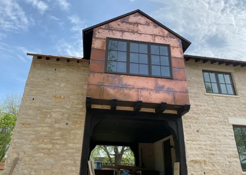 Copper metal panel facade on a stone building for Skylight Installation in Vandalia